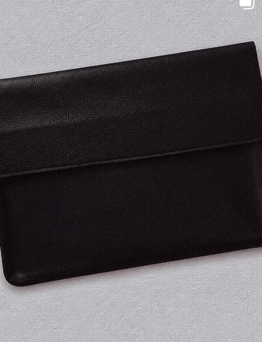 A hand-stitched PRNCE wallet, laid flat